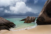 Beach below a stormy grey sky. La Digue island, Seychelles. October 2012. Non-ex.