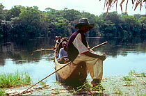Local people with pirogue on the Momboyo river, Democratic Republic of the Congo, 2008-2009.