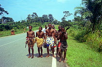 Bapunu initiates celebrating their circumcision and transition to manhood. Gabon, 2008.