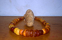 Ancient terracotta Bambara head carving and amber beaded necklace. Mali, 2005-2006.