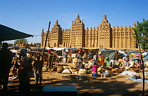 Market outside Djenne mosque. Built in 1325, it is the world's largest mud / clay  building. Mali, 2005-2006.
