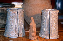 Sao terracotta head with two Bagirmi aluminum amulets. Chad, 2002-2003.