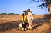 Two Goran villagers posing with sheep, Chad, 2002-2003.
