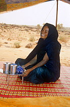 Nomadic woman serving tea, central Mauritania, 2005.