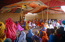 Guests in colorful outfits at a wedding in Atar, Mauritania, 2005.