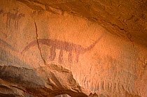 Ancient rock painting of dinosaur-like animal figure, Guilemsi, central Mauritania, 2004.