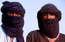Two men, faces covered,  at traditional Peul / Fula ceremony, Ngarawal Fuduk, near Agadez, Niger, 2005.