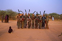 Men dressed up, performing in traditional Peul / Fula ceremony, Ngarawal Fuduk, near Agadez, Niger, 2005.