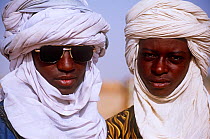 Portrait of two Peul / Fula men, one wearing sunglasses, at Ngarawal Fuduk near Agadez, Niger, 2005.