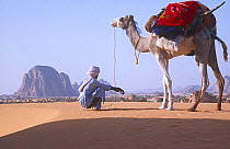Bede, a Toubou guide, with camel crossing the Sahara, Niger, 2005.