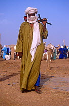 Portrait of Tuareg camel trader in traditional clothing, Agadez market, Niger, 2004.