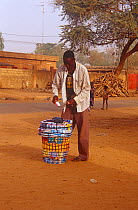 Street vendor wearing Osama bin Laden t- shirt, Niger, 2003.