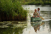 Tourists canoeing on the Peene river, Anklam, Germany, August 2014.