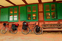 Bicycles and luggage outside hotel in Stolpe, Peene river, Germany, August 2014.