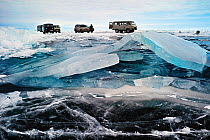 Vehicles parked on ice on the surface of Lake Baikal, Siberia, Russia, March 2008.
