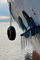 Boat hull with icicles. Lake Baikal, Siberia, Russia, December 2008.