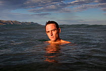 William Trubridge, a world champion free diver who is campaigning to protect the Critically Endangered Maui's dolphin (Cephalorhynchus hectori maui) endemic to New Zealand. December 2012.  Editorial u...