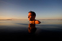 William Trubridge, a world champion free diver who is campaigning to protect the Critically Endangered Maui's dolphin (Cephalorhynchus hectori maui) endemic to New Zealand. January 2008.  Editorial us...