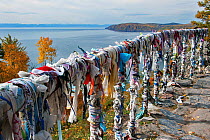 Prayer flags / scarves on the shore of Lake Baikal, Pribaikalsky National Park, Siberia, Russia, September 2013.