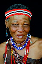 Portrait of Naro San woman wearing traditional clothing and headband, Kalahari, Ghanzi region, Botswana, Africa. October 2014.