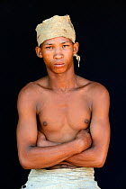 Portrait of Naro San Bushman with leather headdress made of duiker skin, Kalahari, Ghanzi region, Botswana, Africa. October 2014.