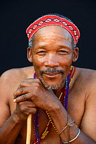 Portrait of Naro San Bushman wearing traditional clothing and headband, Kalahari, Ghanzi region Botswana, Africa. October 2014.