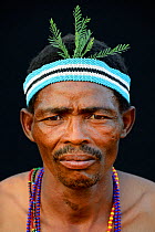 Portrait of Naro San Bushman wearing traditional  headband, Kalahari, Ghanzi region Botswana, Africa. October 2014.