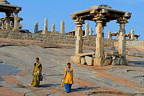 Female pilgrims at the ruins and temple complex in Hampi, former capital of the Vijayanagar kingdom, Karnataka, India, April 2010.