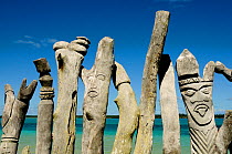 Wooden sculptures of faces, Ile des Pins (Pine Island), New Caledonia, September 2008.