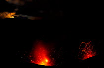 Eruption of Yasur volcano, with full moon just before dawn. Tanna Island, Vanuatu. September 2008.