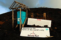 Sign and box for volcano post, the only known post box on an active volcano. Mount Yasur, Tanna Island, Vanuatu, September 2008.