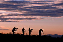 Photographers silhouetted  at sunrise on Steptoe Butte, Steptoe Butte State Park, Whitman County, Washington, USA, June 2014.