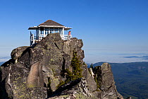 Lookout point on top of Mount Pilchuck, Mount Pilchuck State Park, Cascade Mountains, Washington, USA, July 2014. Model released.