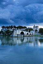The Pont St-Benezet, Palais des Papes and Rhone River at dusk, Avignon, Provence, France, October 2012.