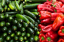 Vegetables, red peppers and courgettes at market at Aix en Provence, France, October.