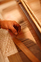 Weaver making silk cloth, Luang Prabang, Laos, March 2009.