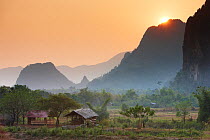 Sun setting over mountains near Vang Vieng, Laos, March 2009.