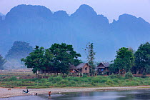 Huts on the shore of the Nam Song River, Vang Vieng, Laos, March 2009.