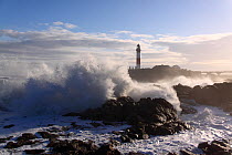 Heavy seas crashing against the coast at Buchan Ness Lighthouse, north-east Scotland, January 2014. All non-editorial uses must be cleared individually.