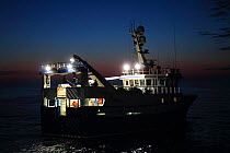 Fishing vessel 'Ocean Harvest' trawling at dusk, North Sea, May 2014. Property released. All non-editorial uses must be cleared individually.