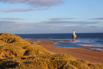 View over dunes of Rattray Head Lighthouse, north-east Scotland, January 2014. All non-editorial uses must be cleared individually.