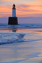 Sunrise at Rattray Head Lighthouse, north-east Scotland, January 2014. All non-editorial uses must be cleared individually.