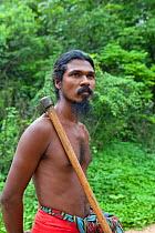Portrait of Vedda tribesman carrying axe, Dambana, Sri Lanka, December 2012.