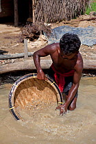 Miner panning for gemstones, Ratnapura, Sri Lanka, December 2012.