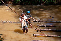 Mine workers dredging for gemstones, Ratnapura, Sri Lanka, December 2012.