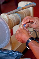 Cutting sapphires using traditional equipment, Ratnapura, Sri Lanka, December 2012.