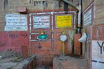 Public toilets on the banks of the Ganges, Varanasi, Uttah Pradesh, India, March 2014.
