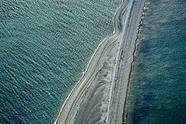 Aerial view of Sillon de Talbert, a sand and pebble barrier beach, at high tide. Pleubian, Cotes d'Armor, Brittany, France.