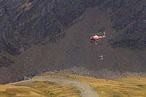 Helicopter distributing rat poison, the beginning of a rat eradication program. Grytviken, South Georgia, February 2011.