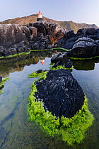 Tide pools and light house on the coast of Heroy, More og Romsdal, Norway, May 2012.